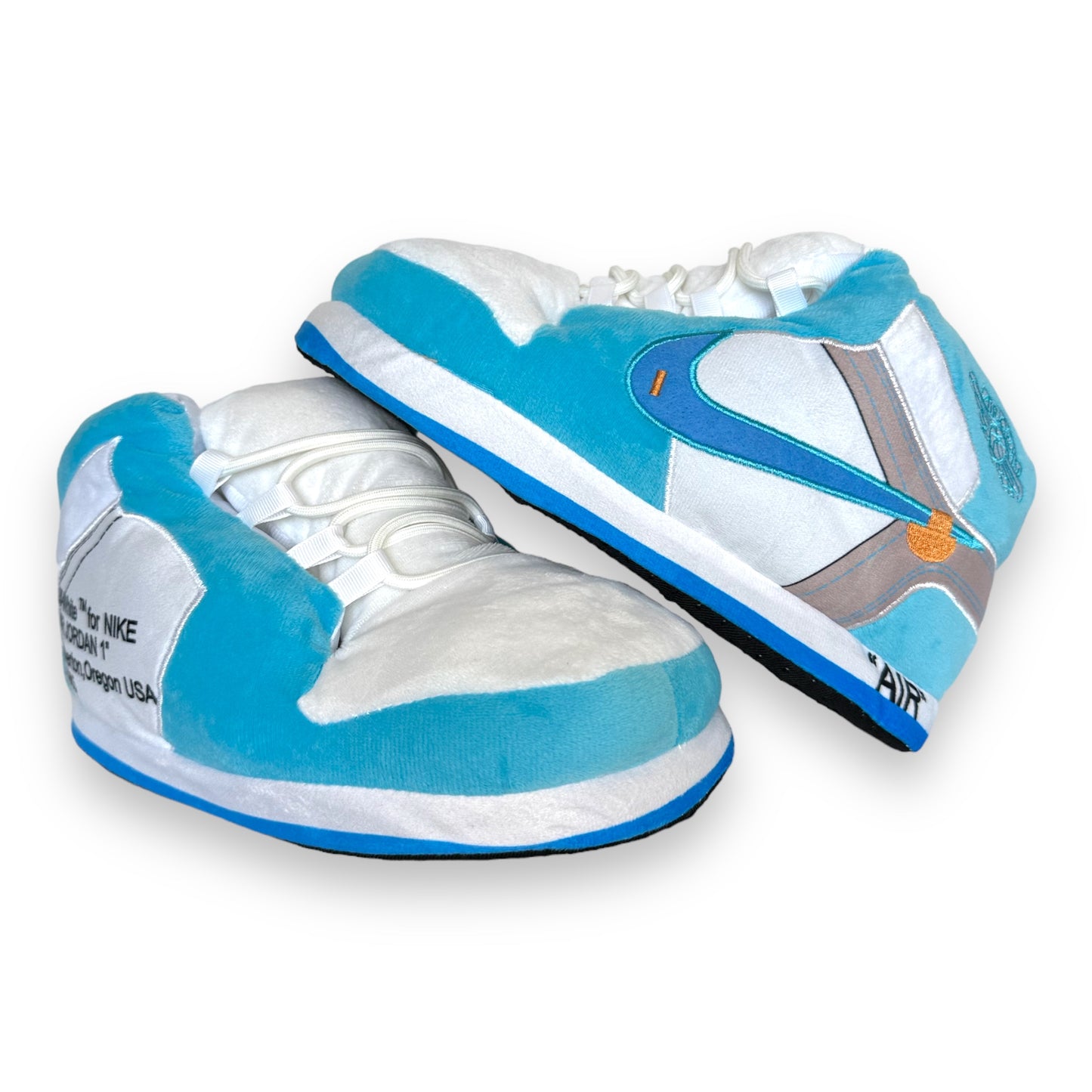 OG AIR Sneaker Slippers – plush baby-blue and white sneaker-inspired house shoes with foam soles and lace details on white background.