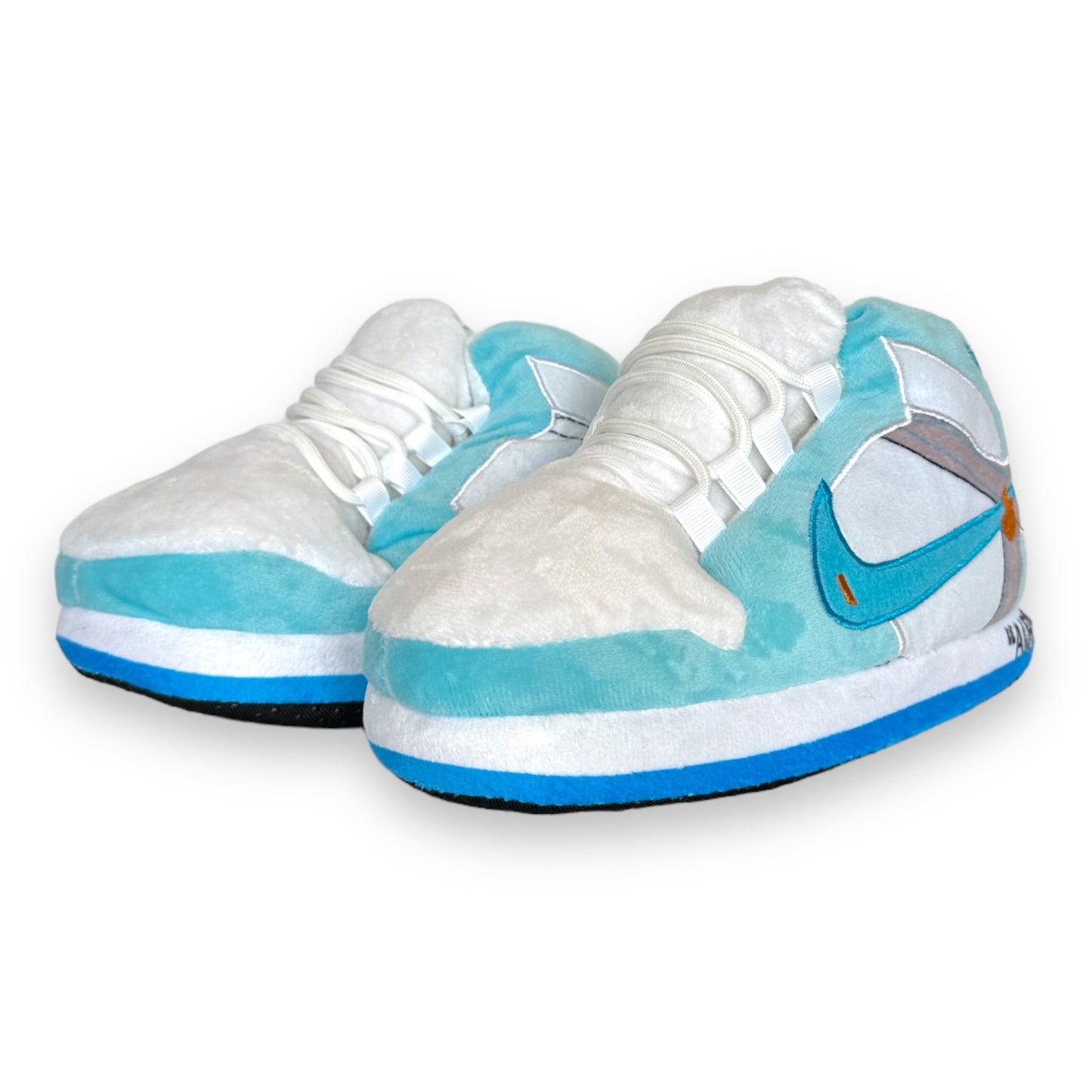 OG AIR Sneaker Slippers for kids – baby-blue and white plush sneaker slippers with cushioned soles and sneaker-style stitching.